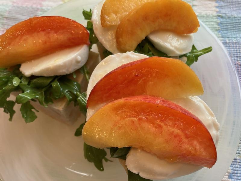 This open-face sandwich features fresh local peaches on focaccia bread with baby arugula and mozzarella cheese for a mouthful of summer flavor. JACK CLEMONS PHOTO